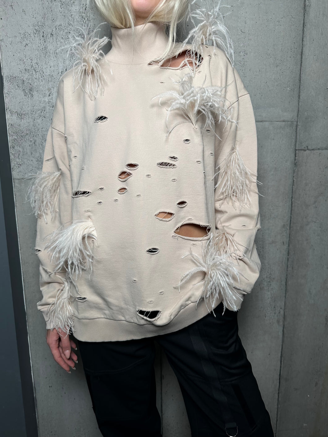 Distressed Turtleneck With Feathers